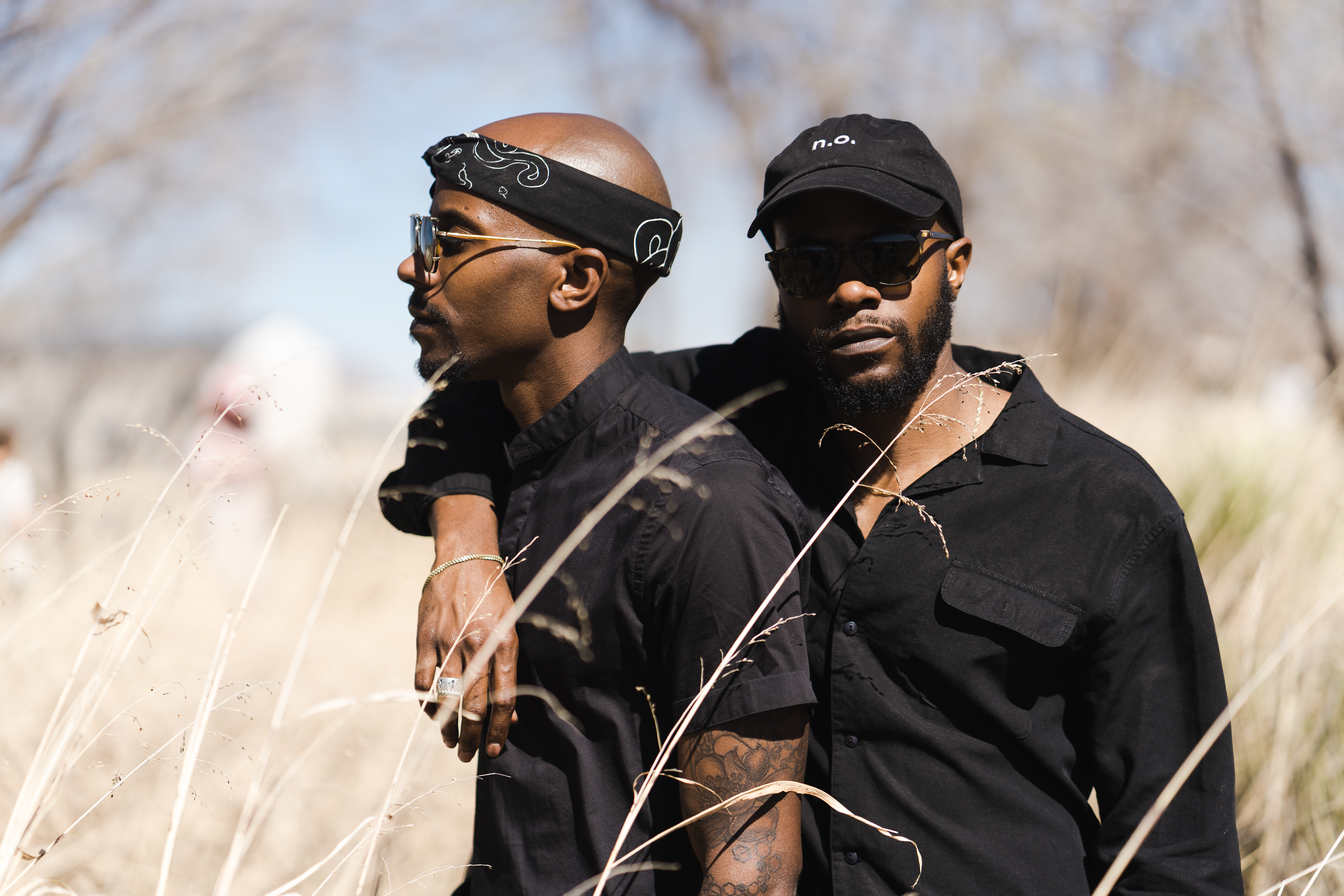 Two men in a grass field